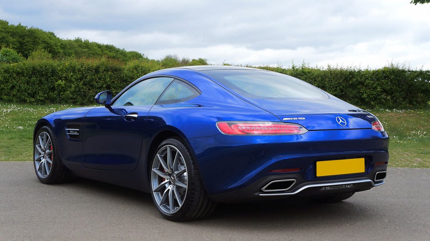 Sleek Blue Sports Car Parked Outdoors Showcasing jigsaw puzzle