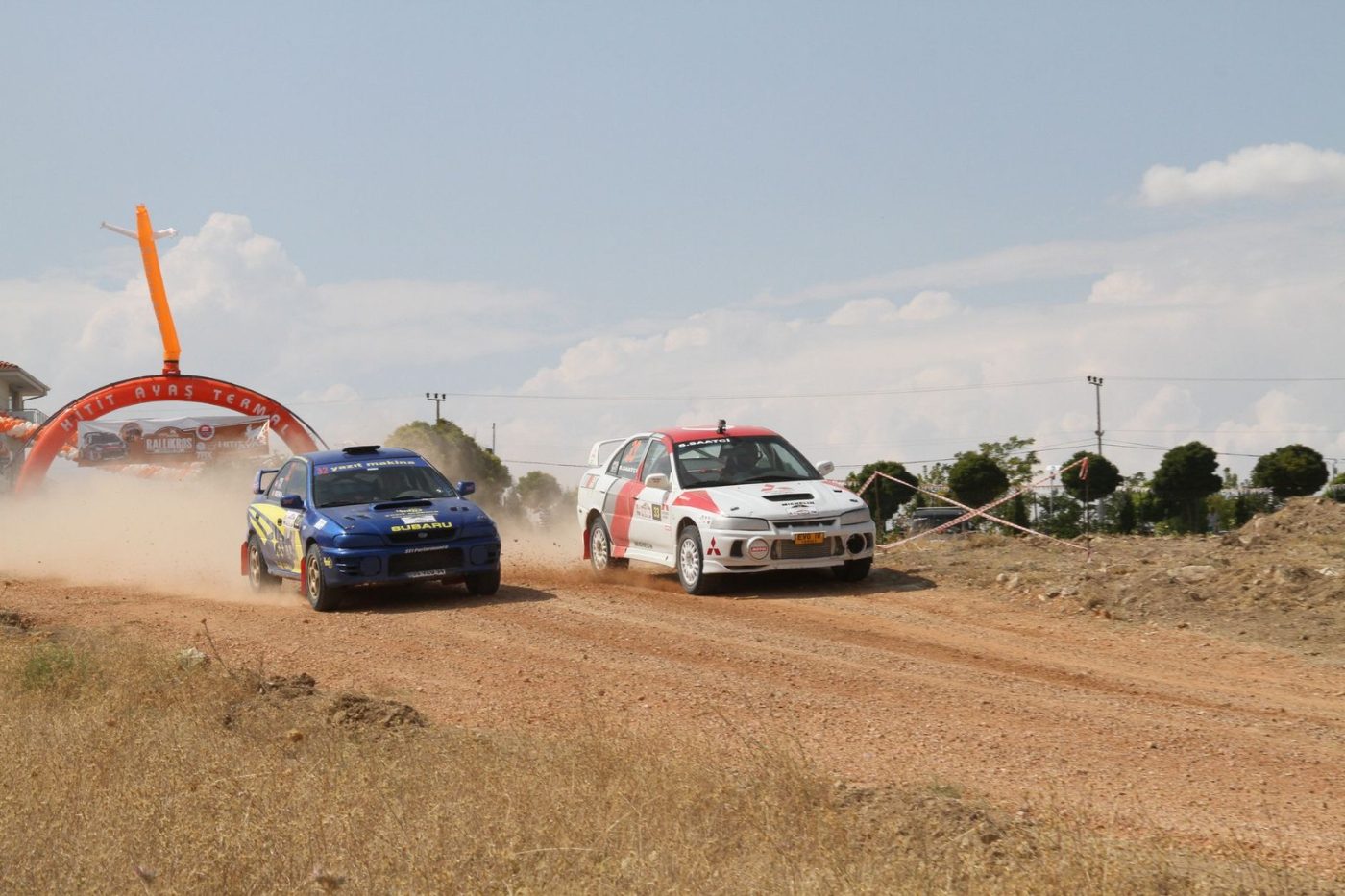Two Rally Cars Speed Through a Dusty jigsaw puzzle