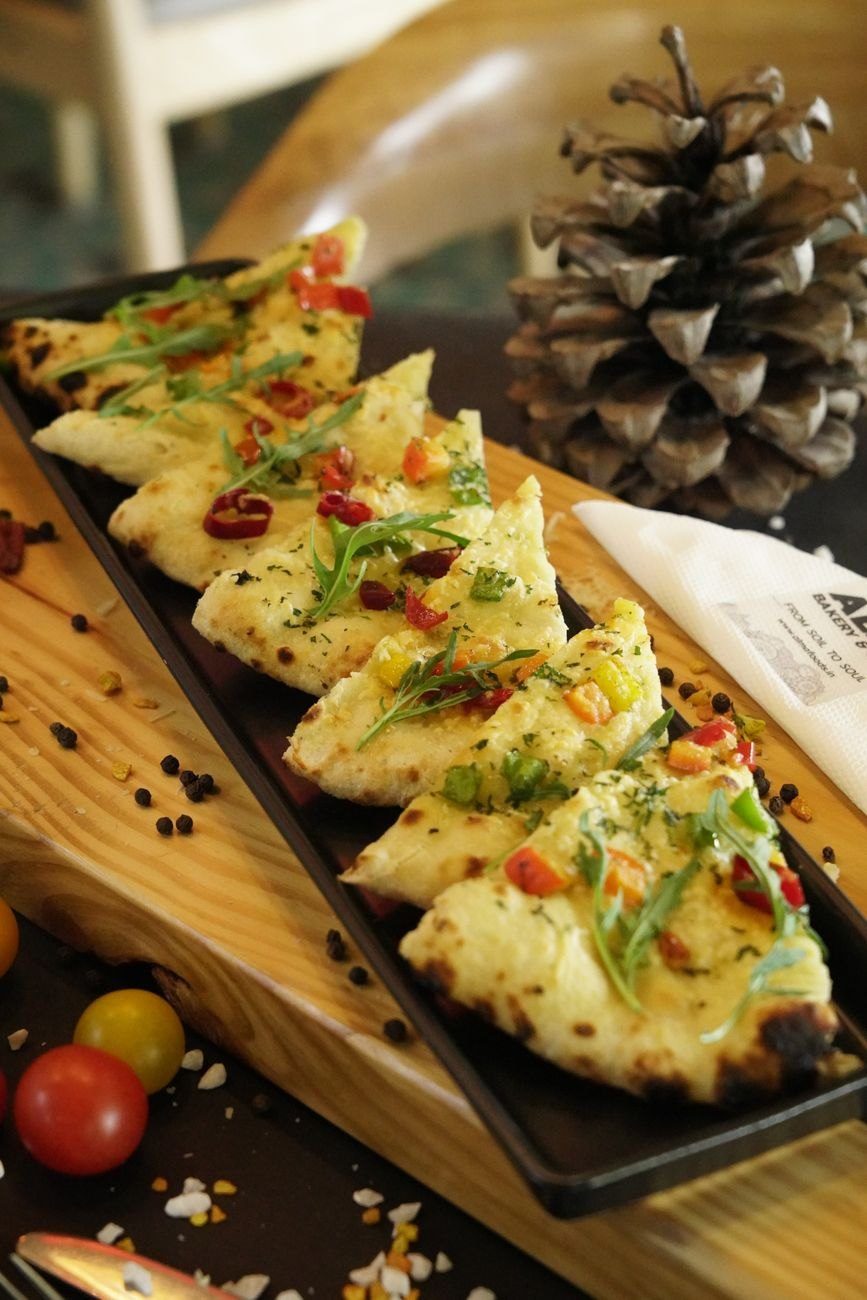 Mouth Watering Flatbread Slices Garnished with Fresh jigsaw puzzle